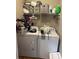 Functional laundry room offers washer, dryer, and shelving for efficient organization at 52 Restful Ln, Hickory, NC 28601