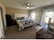 Comfortable bedroom featuring a ceiling fan, neutral tones, and natural light at 52 Restful Ln, Hickory, NC 28601
