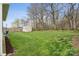Expansive backyard featuring a storage shed, grassy area, and a border of trees at 5386 Josephine Sw Ln, Concord, NC 28027