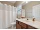 Well-lit bathroom features a vanity with a sink, mirror, and shower with a curtain at 5386 Josephine Sw Ln, Concord, NC 28027