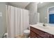 Functional bathroom with a shower featuring a white curtain and single sink at 5386 Josephine Sw Ln, Concord, NC 28027