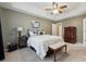 Cozy bedroom features a tray ceiling, soft carpet, and neutral green walls for a relaxing atmosphere at 5386 Josephine Sw Ln, Concord, NC 28027