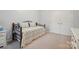 Cozy bedroom features soft carpet and a comfortable daybed for relaxation at 5386 Josephine Sw Ln, Concord, NC 28027