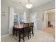Bright dining area features a cozy table and chairs with ample natural light at 5386 Josephine Sw Ln, Concord, NC 28027