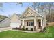 Inviting single-story home with a cozy front porch and a well-maintained lawn at 5386 Josephine Sw Ln, Concord, NC 28027