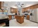 Well-equipped kitchen with stainless steel appliances, granite countertops, and a center island at 5386 Josephine Sw Ln, Concord, NC 28027