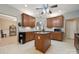 Spacious kitchen features wood cabinets, granite countertops, and a center island at 5386 Josephine Sw Ln, Concord, NC 28027