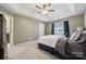 Comfortable main bedroom offers a tray ceiling, a window, and soft neutral colors at 5386 Josephine Sw Ln, Concord, NC 28027