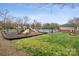 Community playground with a large play structure and a swimming pool in the background at 5386 Josephine Sw Ln, Concord, NC 28027