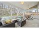 Inviting sunroom with comfortable seating, ceiling fans, and views of the landscaped backyard at 5386 Josephine Sw Ln, Concord, NC 28027