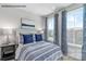 Inviting bedroom with blue accents, cozy bedding, and bright natural light at 6029 Fonsac Ln # 2008C, Charlotte, NC 28217