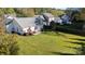 Aerial view of large backyard, patio with table and chairs, and lush green grass at 611 Chase Brook Dr, Rock Hill, SC 29732
