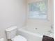 Bright bathroom featuring a window and a soaking tub at 611 Chase Brook Dr, Rock Hill, SC 29732