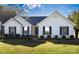Charming single-story home featuring manicured landscaping and a well-maintained lawn at 611 Chase Brook Dr, Rock Hill, SC 29732