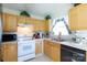 Cozy kitchen with ample cabinet space, white appliances, and plenty of counter space at 611 Chase Brook Dr, Rock Hill, SC 29732