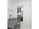 Modern laundry room with a large window and washer/dryer at 611 Chase Brook Dr, Rock Hill, SC 29732