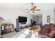 Spacious living room with vaulted ceilings, a ceiling fan, and a comfortable leather sofa at 611 Chase Brook Dr, Rock Hill, SC 29732