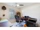Home office with desk, rolling chair, and natural lighting at 611 Chase Brook Dr, Rock Hill, SC 29732