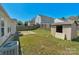 The spacious backyard features a storage shed and wood fence at 6821 Parkers Crossing Dr, Charlotte, NC 28215