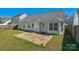 Backyard featuring a concrete patio and the rear of the home at 6821 Parkers Crossing Dr, Charlotte, NC 28215