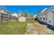 Backyard featuring a concrete patio, wooden fence, storage shed, and grass at 6821 Parkers Crossing Dr, Charlotte, NC 28215