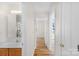 Hallway with hardwood floors leading to bathroom and bedroom at 6821 Parkers Crossing Dr, Charlotte, NC 28215