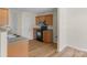 Bright kitchen features wood cabinets, granite counters, stainless steel microwave, and black oven range at 6821 Parkers Crossing Dr, Charlotte, NC 28215