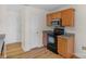 Kitchen featuring stainless steel appliances and light wood cabinets at 6821 Parkers Crossing Dr, Charlotte, NC 28215