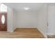 Bright living room featuring light wood floors and neutral paint at 6821 Parkers Crossing Dr, Charlotte, NC 28215