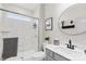 Bathroom featuring white marble walk-in shower and gray vanity with modern fixtures at 7313 Glenroe Dr, Huntersville, NC 28078
