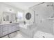 Luxurious bathroom featuring a soaking tub, glass shower, and modern fixtures at 7313 Glenroe Dr, Huntersville, NC 28078