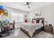 A bedroom with neutral decor, a large window, and an accent wall at 7313 Glenroe Dr, Huntersville, NC 28078