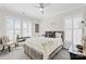 A cozy bedroom with a neutral palette, shuttered windows, and desk area at 7313 Glenroe Dr, Huntersville, NC 28078