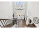 An impressive foyer boasts a high ceiling, chandelier, and staircase at 7313 Glenroe Dr, Huntersville, NC 28078
