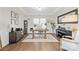 Well-lit home office boasting hardwood floors, built-in shelving, and modern decor at 7313 Glenroe Dr, Huntersville, NC 28078