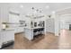 A spacious kitchen features an island with seating and stainless steel appliances at 7313 Glenroe Dr, Huntersville, NC 28078
