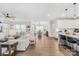 Open-concept living space with hardwood floors, island seating, and a spacious layout at 7313 Glenroe Dr, Huntersville, NC 28078