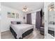 Cozy bedroom with a ceiling fan, window, and unique decor at 816 Gentlewinds Ct, Fort Mill, SC 29708