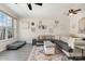 Bright living room featuring stylish decor, a comfortable sectional, and large windows at 816 Gentlewinds Ct, Fort Mill, SC 29708