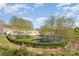 Scenic pond view surrounded by lush greenery in a well-maintained community at 816 Gentlewinds Ct, Fort Mill, SC 29708