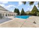 View of the swimming pool and pool house on a sunny day at 816 Gentlewinds Ct, Fort Mill, SC 29708