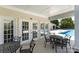 Covered patio with tables and chairs near the community pool at 816 Gentlewinds Ct, Fort Mill, SC 29708