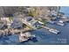 Aerial view of lakefront homes, docks, boats, and a beautiful lake with a gazebo dock at 938 Pinehaven Dr, New London, NC 28127