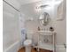 Cozy bathroom with a white vanity and a tub/shower combination at 938 Pinehaven Dr, New London, NC 28127