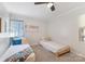 Bedroom with twin beds, playroom wall art, and carpet at 938 Pinehaven Dr, New London, NC 28127