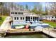 Lakefront home featuring a spacious deck, dock, and easy access to the water at 938 Pinehaven Dr, New London, NC 28127