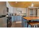 Bright kitchen with granite countertops, stainless steel appliances, and two-tone cabinetry at 938 Pinehaven Dr, New London, NC 28127
