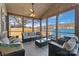 Inviting screened porch with comfortable seating and panoramic lake views at 938 Pinehaven Dr, New London, NC 28127