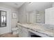 Bathroom featuring a marble countertop vanity with a sink, a large mirror and a shower at 10241 Barrands Ln, Charlotte, NC 28278