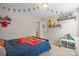 Bedroom featuring neutral walls, carpet flooring, a window and race car decor at 10241 Barrands Ln, Charlotte, NC 28278
